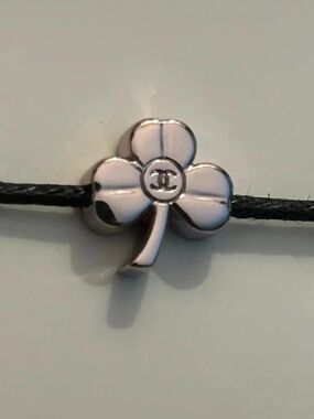 CHANEL rare Black Cord Bracelet with four-leaf clover charm in silver Accent NEW